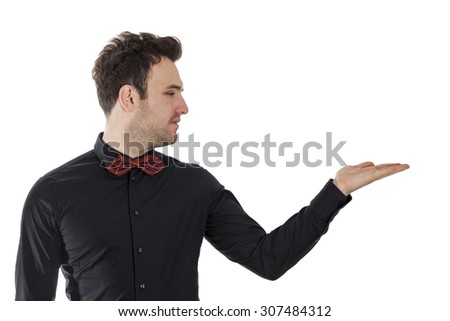 Profile of a handsome young man offering something on his palm isolated against a white background.