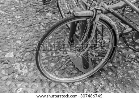 Close-up of an old bicycle wheel (black and white picture)