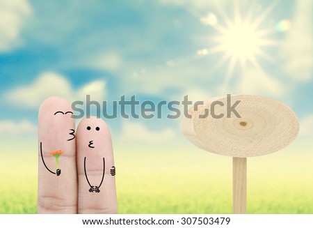 Couple finger holding flower on  nature background