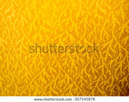 Close Up of gold fabric delicate at stripe pattern background.