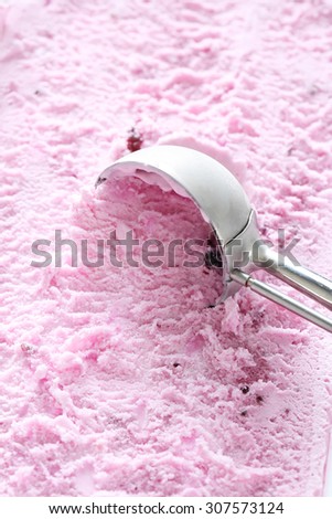 Sweet ice cream scooped out from container