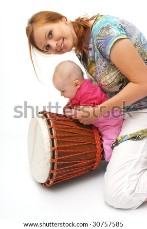 picture of happy mother with baby with drum over white