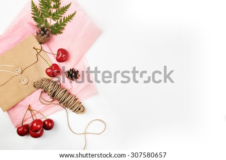 white background table, envelope and  cherry, invitation