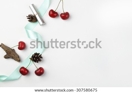 white background table, view table mockup, cherry and lipstick