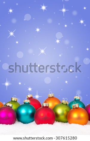 Many colorful Christmas balls background decoration with stars, snow and copyspace
