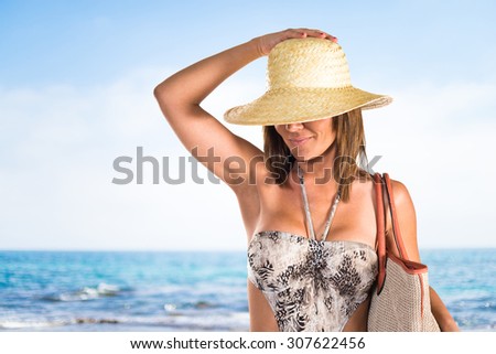 Woman in bikini on unfocused background