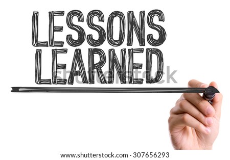 Hand with marker writing the word Lessons Learned Royalty-Free Stock Photo #307656293