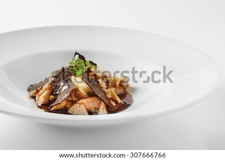 Italian risotto with sweetbread and black truffles Royalty-Free Stock Photo #307666766