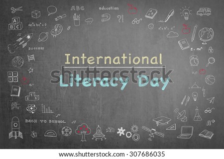 International literacy day on black chalkboard with doodle 