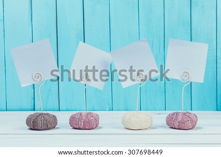 Note holders on blue wooden background