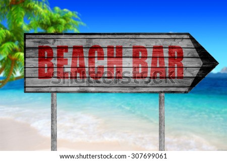 Red Beach Bar wooden sign with on a beach background