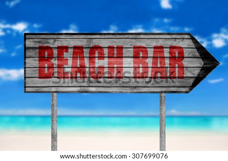 Red Beach Bar wooden sign with on a beach background