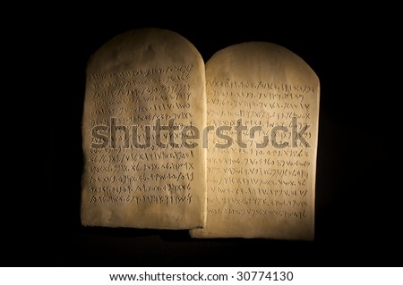 Biblical Ten Commandments inscribed on stone tablets in the Paleo-hebrew script Royalty-Free Stock Photo #30774130