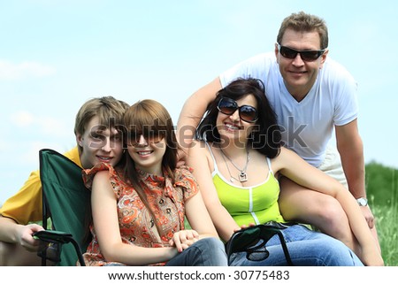 Happy family having a rest together outdoor.