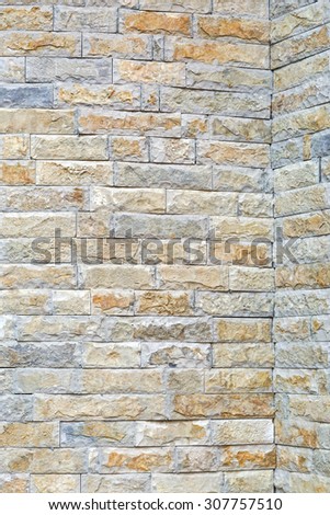 Stone tiles with rough surface at house wall