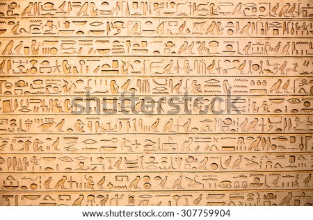 Egyptian hieroglyphs on the wall Royalty-Free Stock Photo #307759904