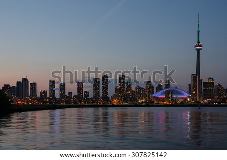 Skyline of Toronto over Ontario Lake after sunset
