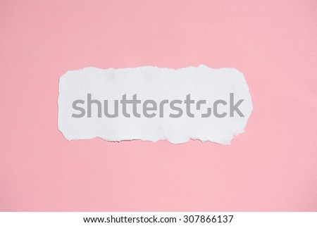 White ripped paper on pink paper texture background