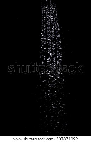 Large drops of water on a black background. Texture. Design elements. The concept of freshness.