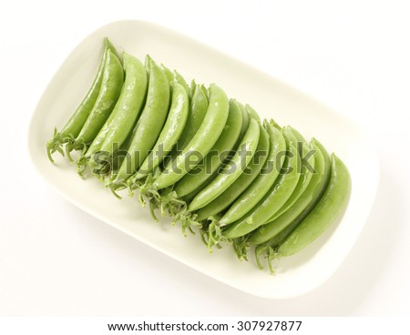 Fresh peas in white plate isolated on white background 