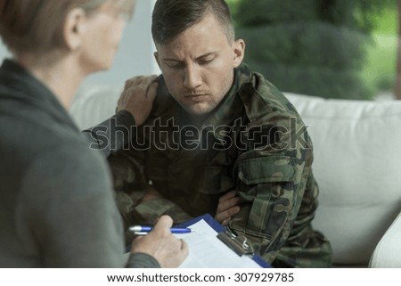 Psychiatrist and despair military man during therapy Royalty-Free Stock Photo #307929785