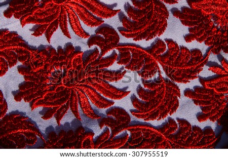 Red lace close up background.