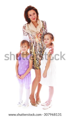 Beautiful skinny young mother dressed in a short dress gently hugs your favourite daughters-Isolated on white background