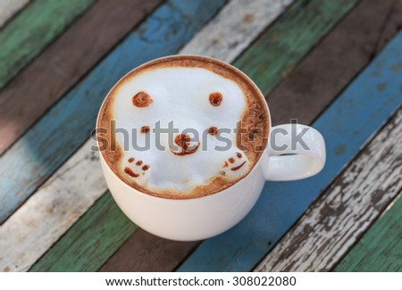 hot cappuccino and latte art cartoon style on wood desk