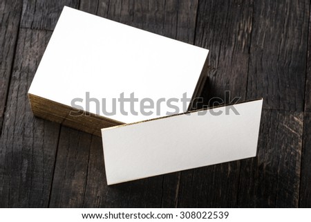 thick white cotton paper business card mock up with golden foil on the edges