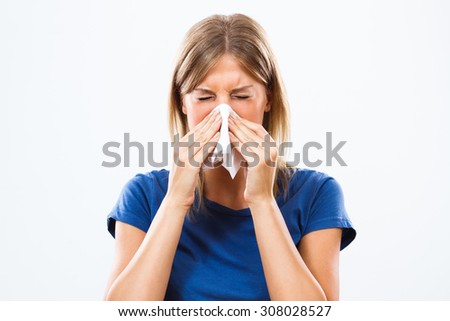 Woman is sneezing into handkerchief.Woman having flu Royalty-Free Stock Photo #308028527