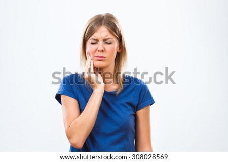 Young woman is having toothache.Toothache