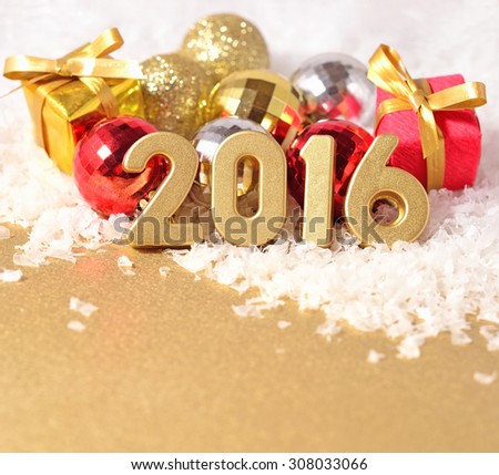 2016 year golden figures on the background of Christmas decorations