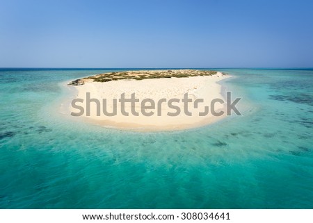In the picture an atoll with fine white sand, turquoise and green  sea surrounded,situated in the Red Sea in Egypt, located between the area of Hamata and Berenice.