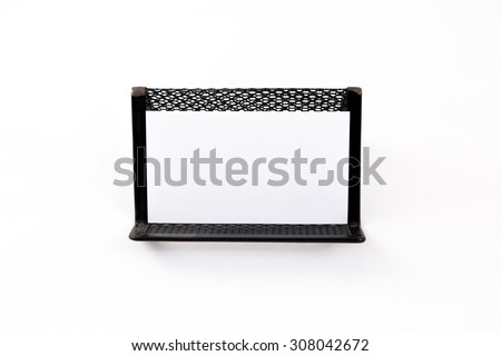 Blank business card on the holder on white background