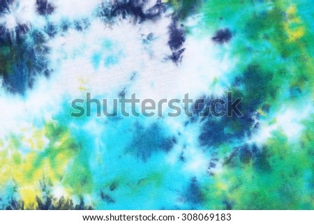 colourful tie dyed pattern on cotton fabric for background.

