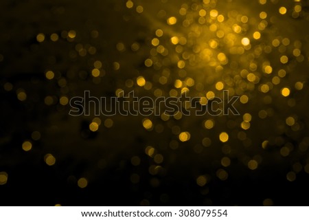 gold bokeh on black background