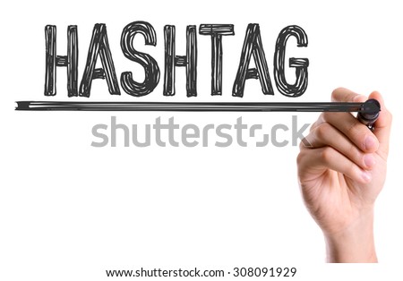 Hand with marker writing the word Hashtag