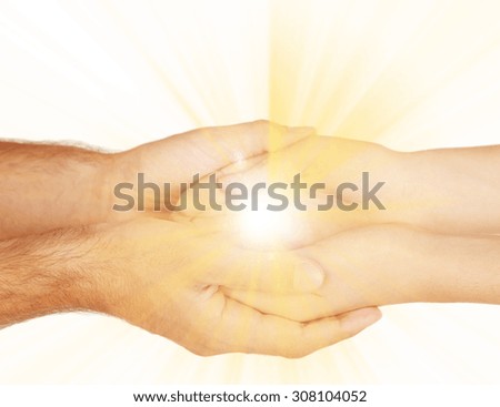 The light in young woman and man hands
