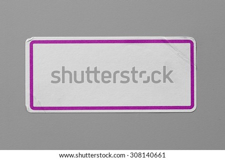Label Adhesive Close Up on Grey Background with Real Shadow. Top View of Adhesive Paper Tag with Pink Border. Stickers with Copy Space for Text or Image