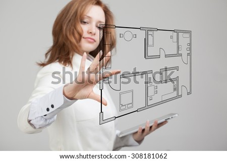 Young woman architect working with a virtual apartment plan Royalty-Free Stock Photo #308181062