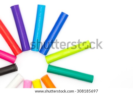 Colorful plasticine clay on white background