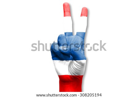 A hand painted with thailand flag making a V for victory symbol, isolated against white.