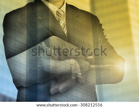 Key to success businessman with double exposure