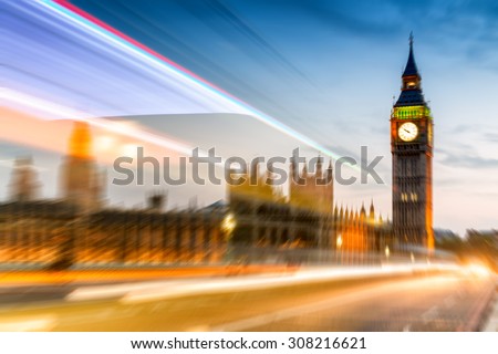 Blurred image of Westminster Bridge and Big Ben at night.