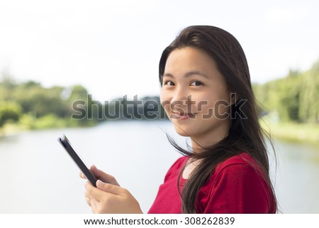 Woman Use Tablet for Relaxation on the Bridge