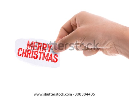 Piece of paper with the word Merry Christmas isolated on white background