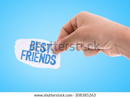 Piece of paper with the word Best Friends with blue background