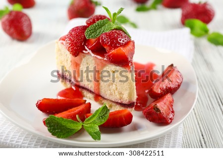 Delicious cheesecake with berries on table close up Royalty-Free Stock Photo #308422511