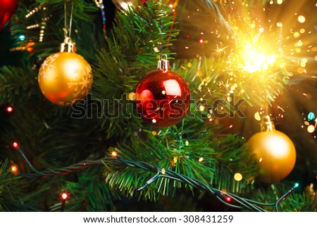 Christmas tree decoration with shiny sparkler