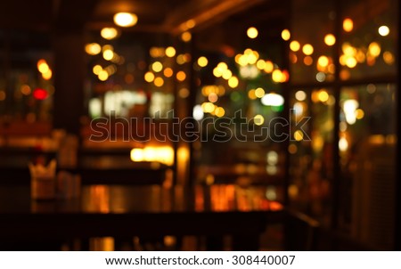 table in blur pub or bar nightclub and restaurant at Christmas night celebrate party with bokeh light background Royalty-Free Stock Photo #308440007